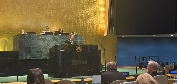 Kurtis Lindqvist speaking at the U.N. General Assembly on 17 December 2025.